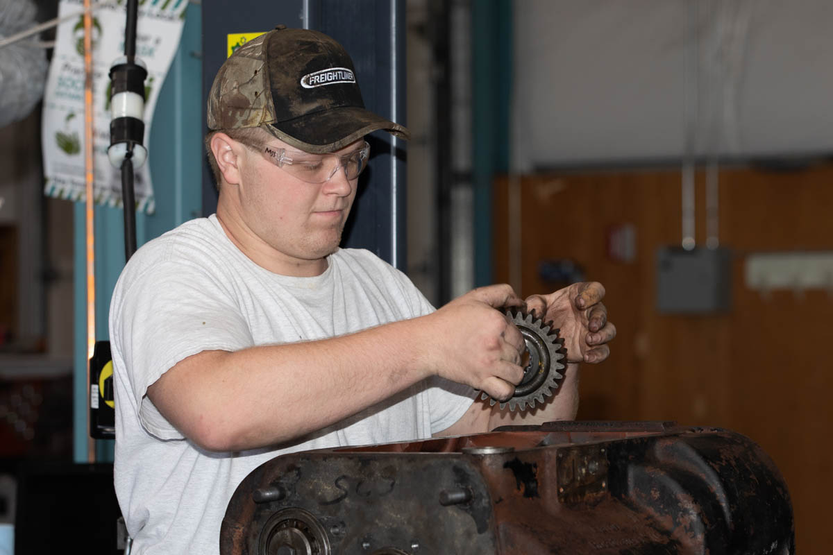 Man working on diesel engine