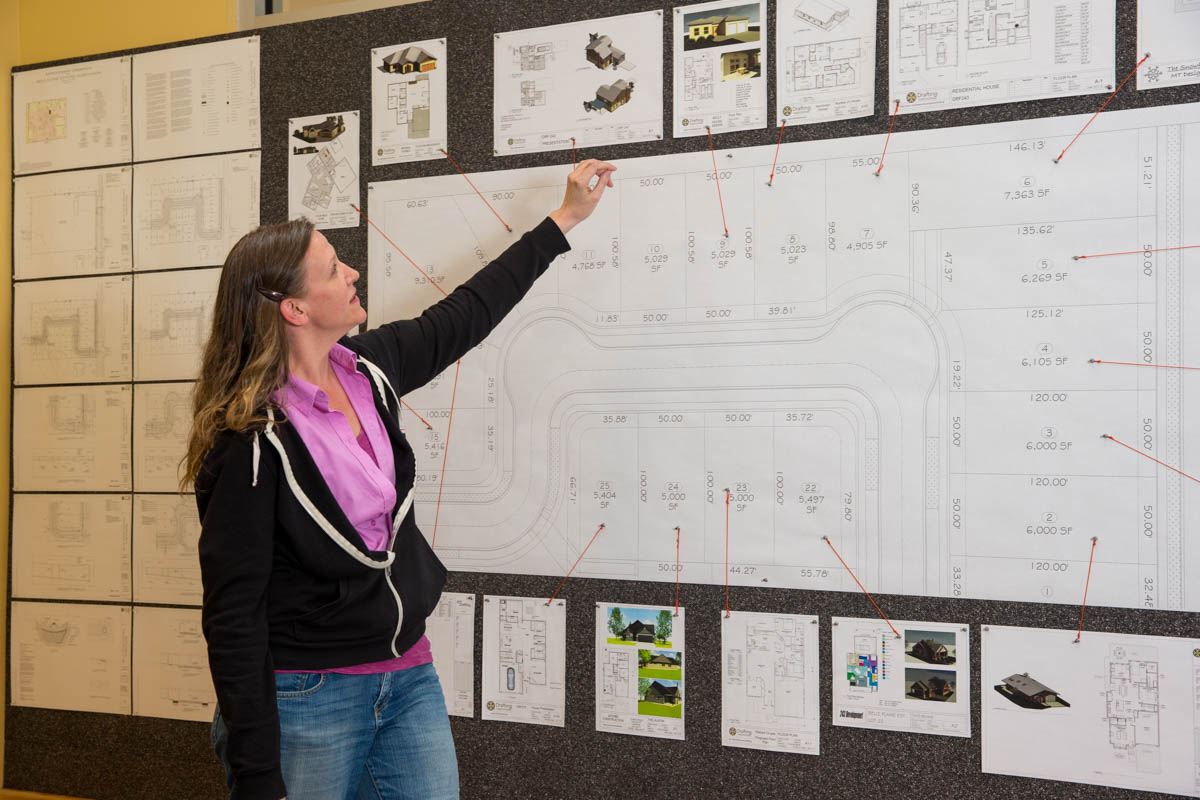 Woman reviewing design plans