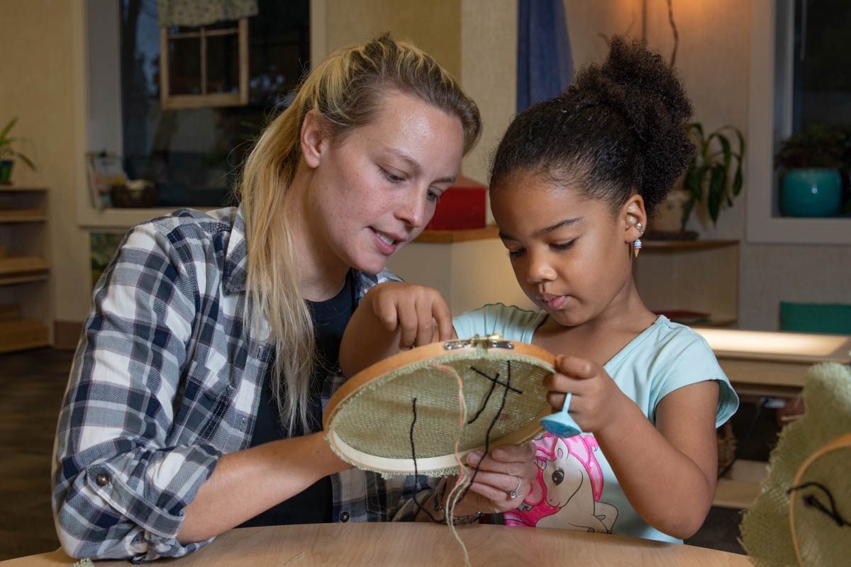 Woman doing crafts with a small child