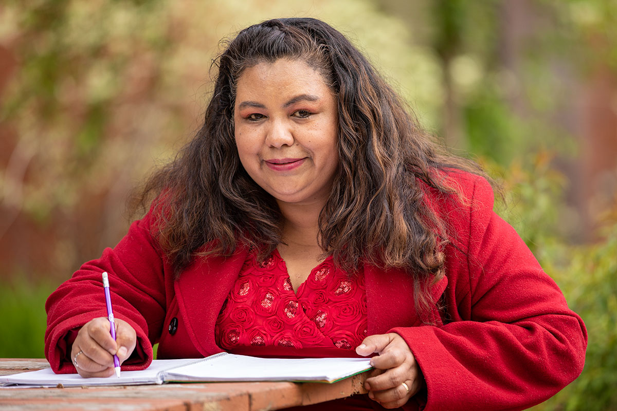 Woman writing in a notebook