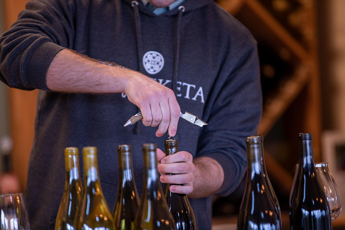 Man opening wine