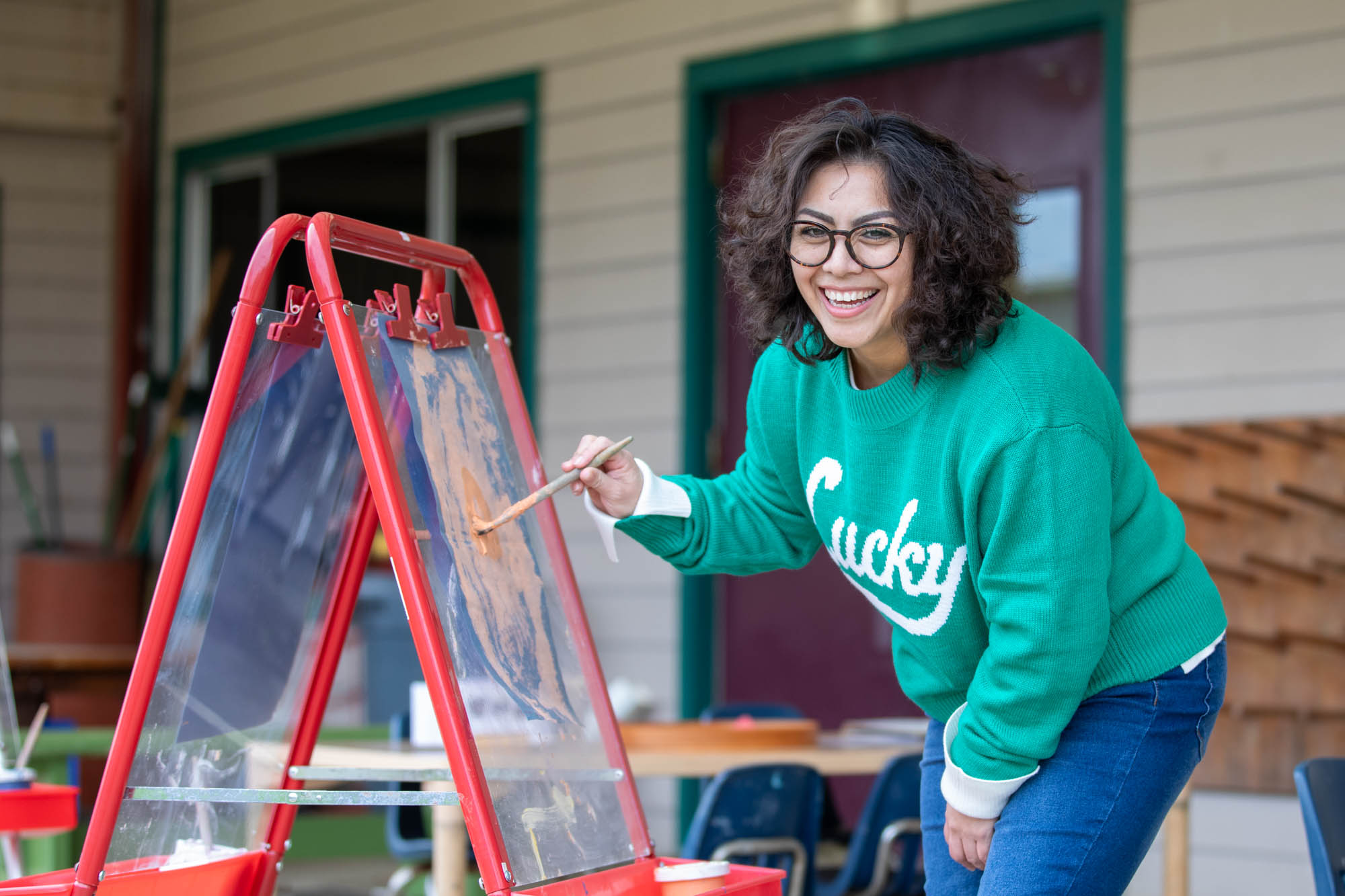 Preschool teacher painting
